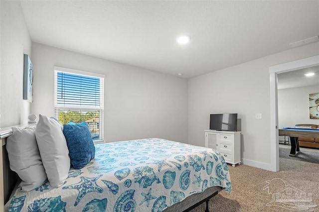 bedroom featuring carpet floors and baseboards