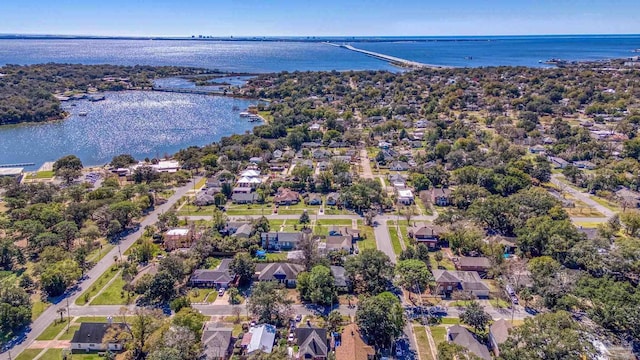 birds eye view of property with a water view and a residential view