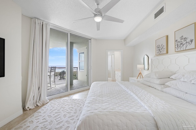 8501 Gulf Blvd Unit 3B, Navarre Beach, FL 32566 - bedroom with floor to ceiling windows, access to exterior, light tile patterned floors, a ceiling fan, and baseboards