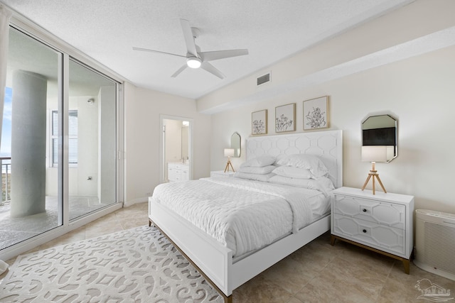 8501 Gulf Blvd Unit 3B, Navarre Beach, FL 32566 - bedroom with light tile patterned flooring, connected bathroom, and a ceiling fan