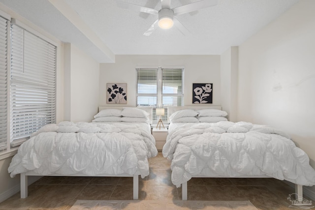 8501 Gulf Blvd Unit 3B, Navarre Beach, FL 32566 - bedroom with tile patterned flooring and a ceiling fan