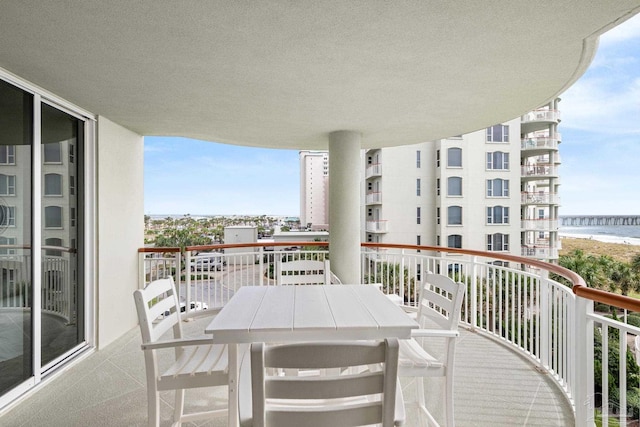 8501 Gulf Blvd Unit 3B, Navarre Beach, FL 32566 - balcony featuring a water view and outdoor dining space