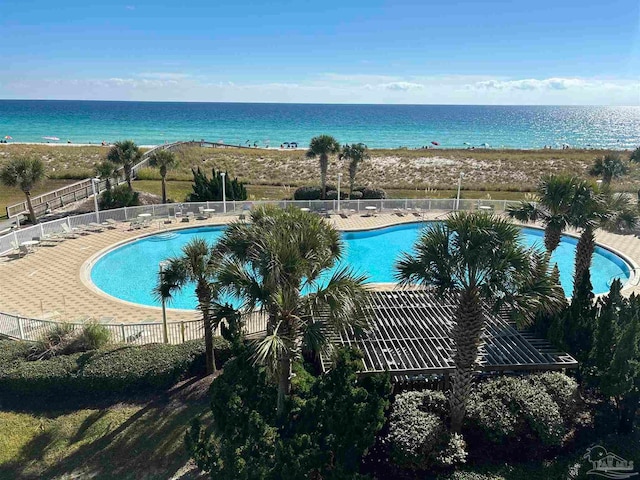 view of pool with a water view