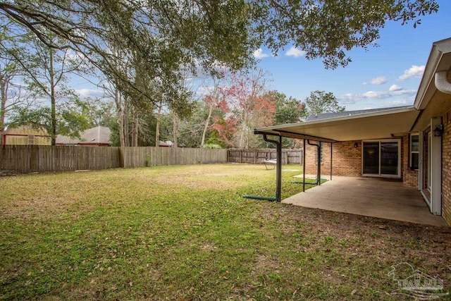 view of yard with a patio area and a fenced backyard