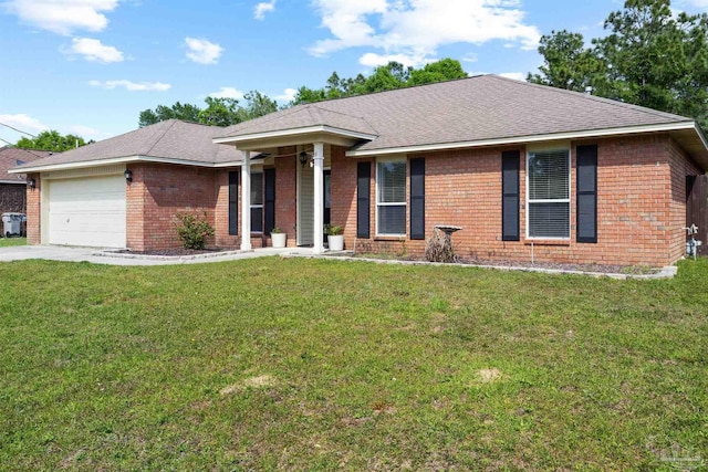 ranch-style home with concrete driveway, an attached garage, brick siding, and a front lawn