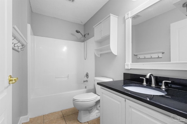 full bath with washtub / shower combination, tile patterned flooring, toilet, vanity, and a textured ceiling