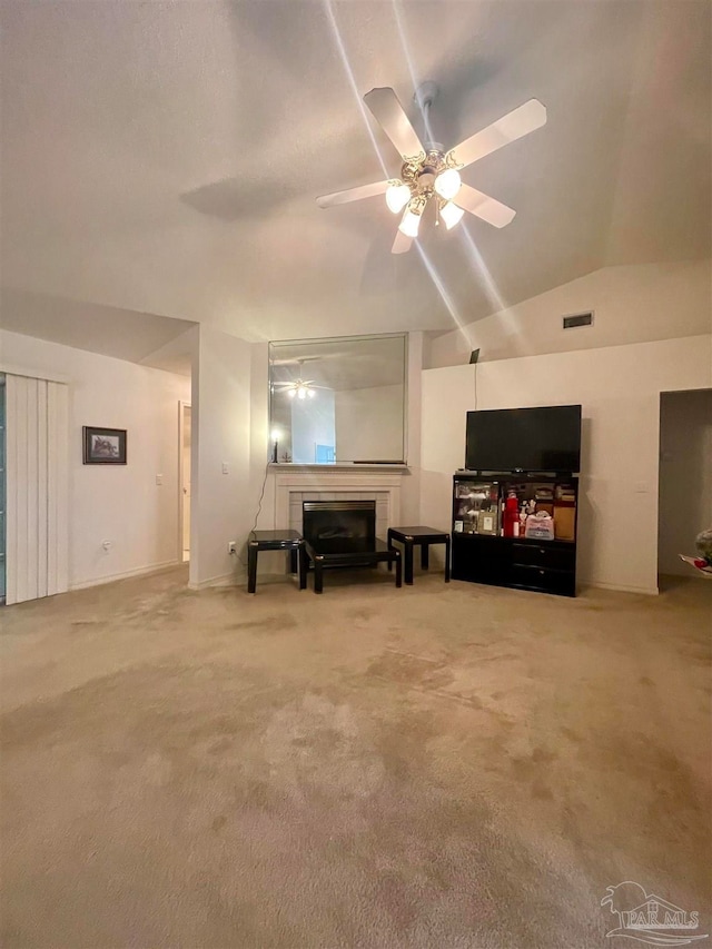 carpeted living room with lofted ceiling and ceiling fan