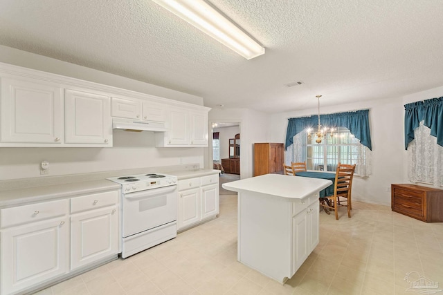 kitchen featuring a chandelier, a kitchen island, white cabinetry, and white electric range oven