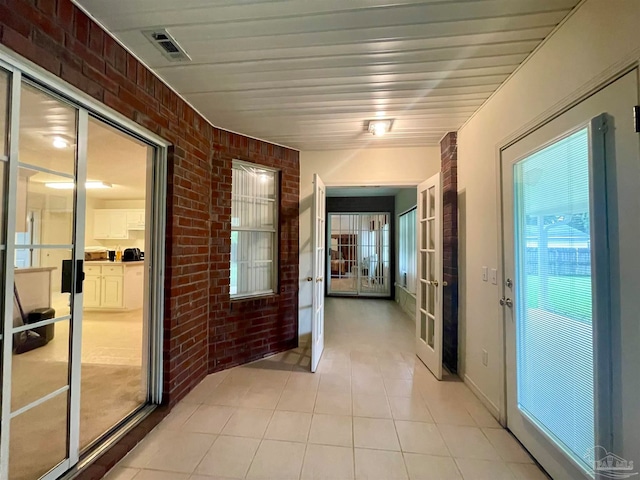 hallway with brick wall