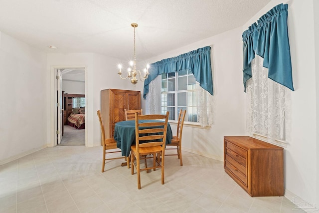 dining space with a chandelier, plenty of natural light, and baseboards