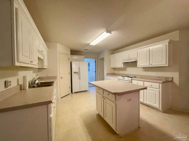 kitchen with a center island, white appliances, white cabinetry, sink, and a textured ceiling