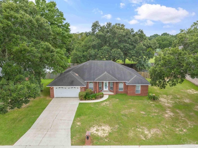 ranch-style house featuring a garage, driveway, brick siding, and a front yard