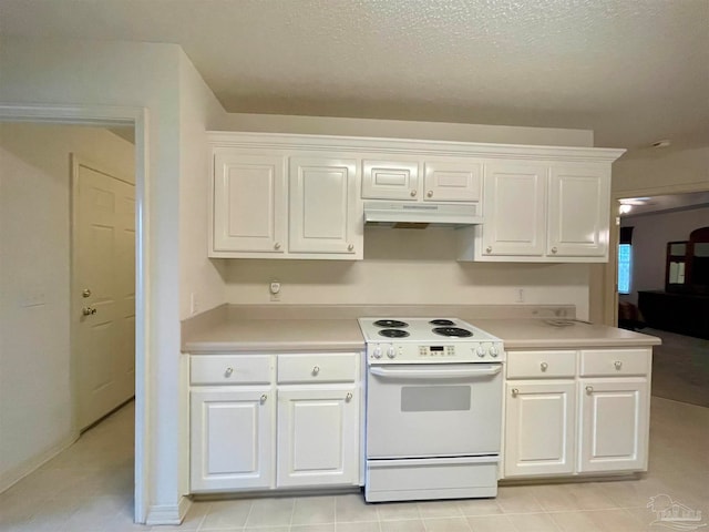 kitchen with a textured ceiling, electric stove, and white cabinets