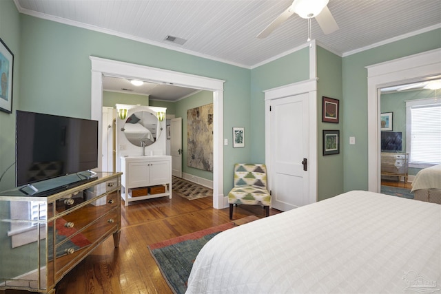 bedroom featuring visible vents, ceiling fan, baseboards, ornamental molding, and dark wood-style flooring