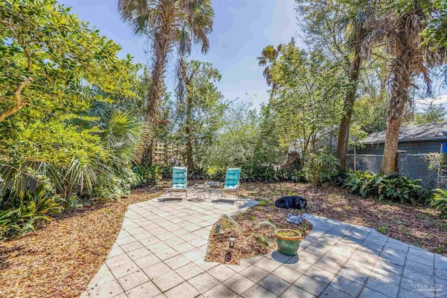 view of patio featuring fence