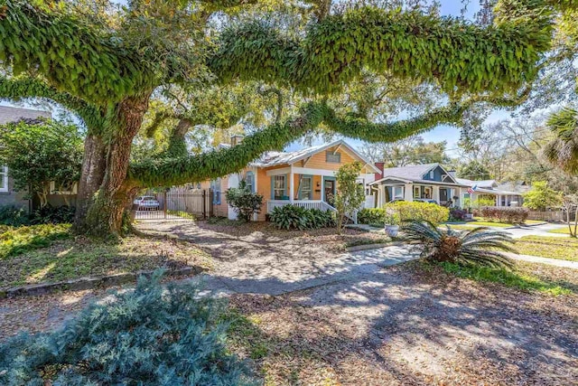 view of front of house featuring fence