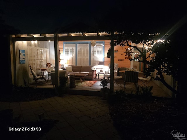 patio at twilight with an outdoor living space