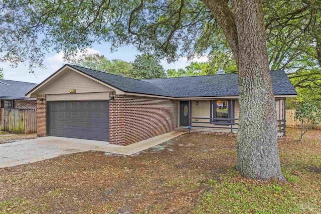 ranch-style home featuring brick siding, fence, driveway, roof with shingles, and an attached garage