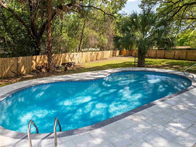 view of swimming pool with a fenced backyard, a fenced in pool, and a lawn