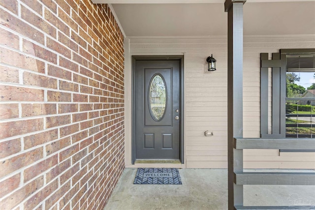 doorway to property featuring a porch