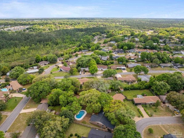 birds eye view of property featuring a residential view and a forest view