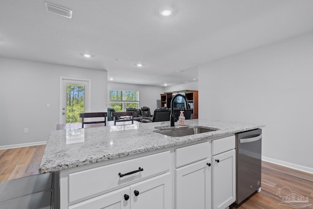 10985 Blacktail Loop, Pensacola, FL 32526 - kitchen featuring a sink, dishwasher, light stone counters, white cabinets, and recessed lighting