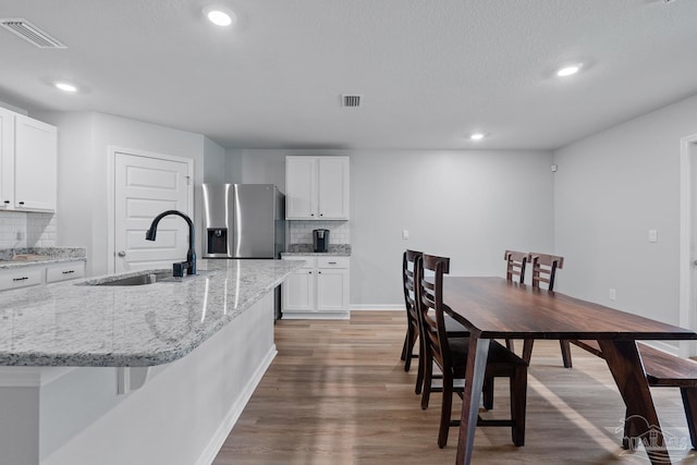 10985 Blacktail Loop, Pensacola, FL 32526 - dining area with wood finished floors, recessed lighting, baseboards, and a textured ceiling