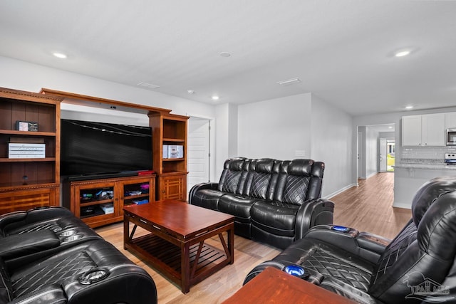 10985 Blacktail Loop, Pensacola, FL 32526 - living room featuring light wood-type flooring, recessed lighting, and baseboards