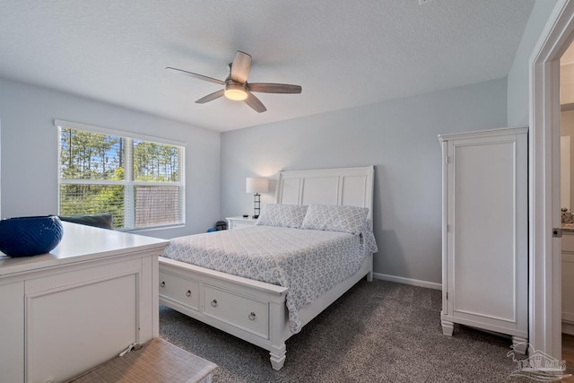10985 Blacktail Loop, Pensacola, FL 32526 - bedroom featuring dark colored carpet, ceiling fan, and a textured ceiling