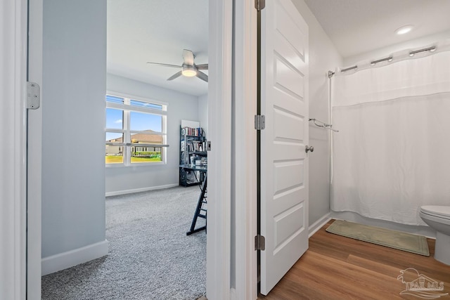 10985 Blacktail Loop, Pensacola, FL 32526 - full bath featuring baseboards, a ceiling fan, toilet, and shower / tub combo