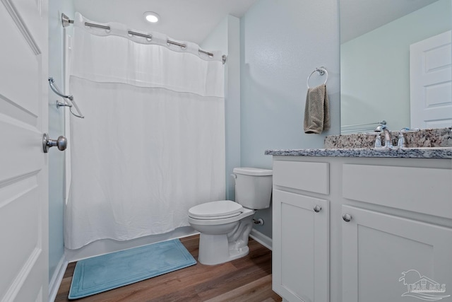 10985 Blacktail Loop, Pensacola, FL 32526 - bathroom with toilet, wood finished floors, vanity, and baseboards