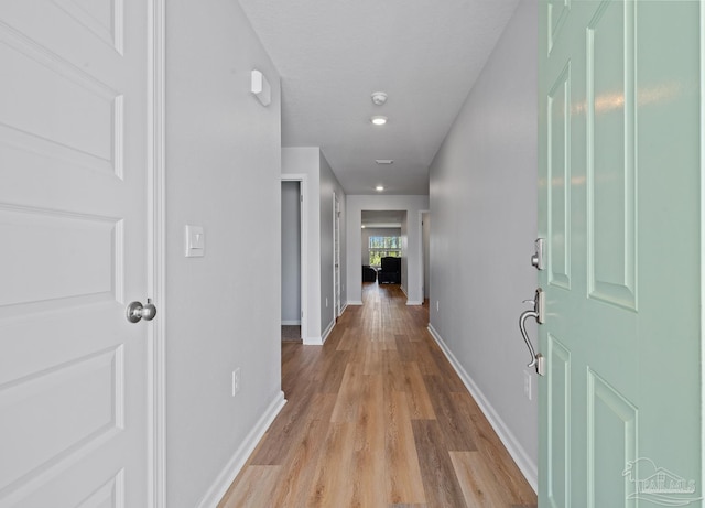 10985 Blacktail Loop, Pensacola, FL 32526 - hall featuring light wood-style floors and baseboards