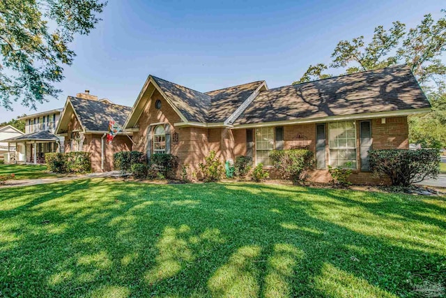 single story home featuring a front yard