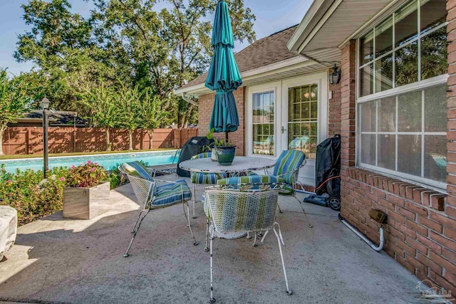 view of patio featuring a fenced in pool