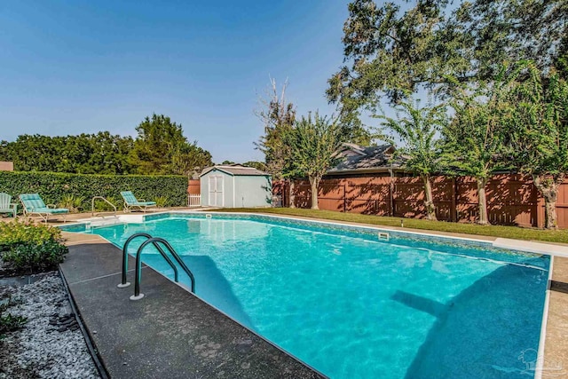 view of pool featuring a storage shed