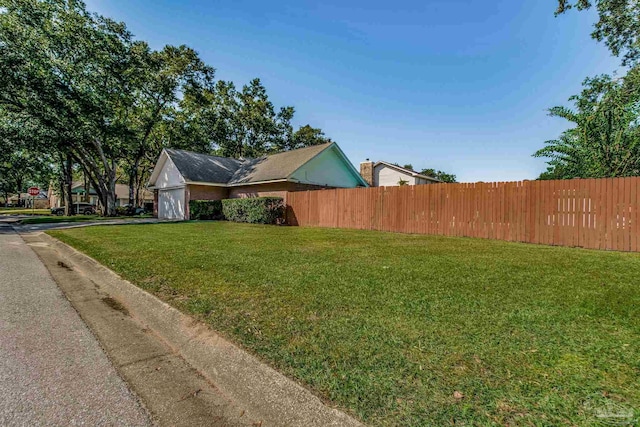 view of property exterior with a lawn