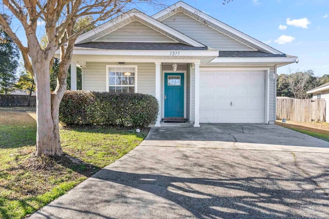 view of front of property with a garage and covered porch