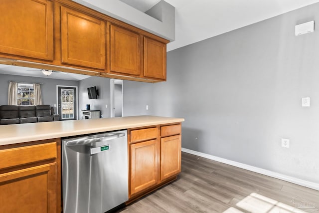 kitchen with light hardwood / wood-style flooring and dishwasher