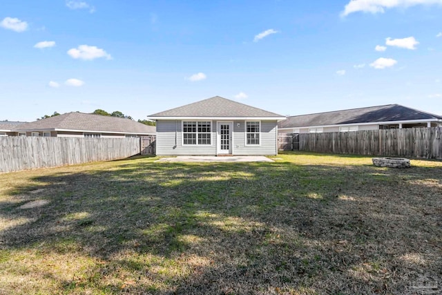 rear view of house featuring an outdoor fire pit, a patio, and a lawn