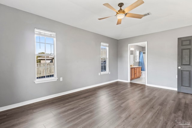 interior space featuring dark wood-type flooring, ceiling fan, and lofted ceiling