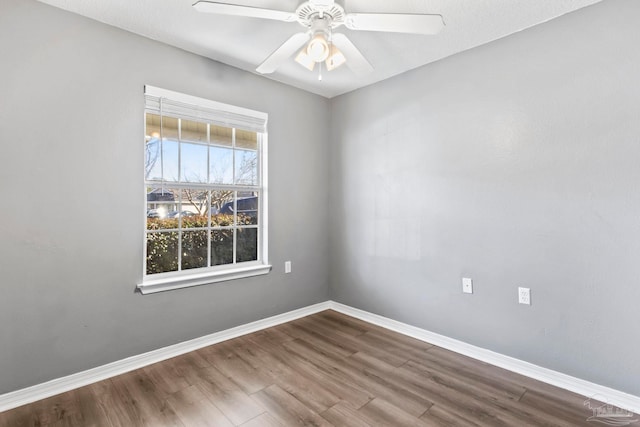 unfurnished room featuring hardwood / wood-style flooring and ceiling fan