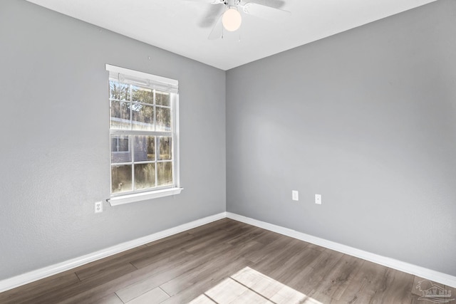 unfurnished room with hardwood / wood-style floors and ceiling fan