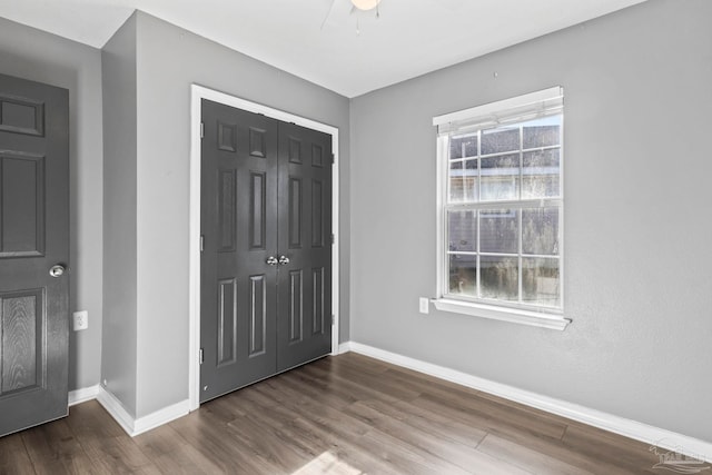 entrance foyer featuring a wealth of natural light and wood-type flooring