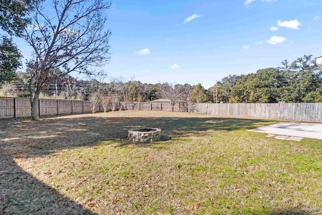 view of yard featuring a fire pit and a patio area