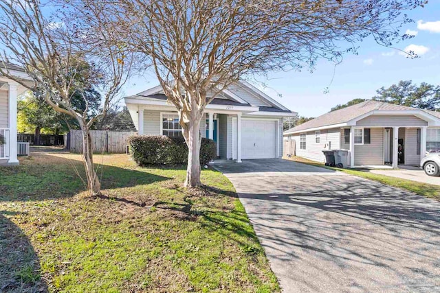 view of front of home featuring a garage and a front yard