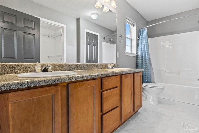 full bathroom featuring vanity, shower / bath combo, and toilet