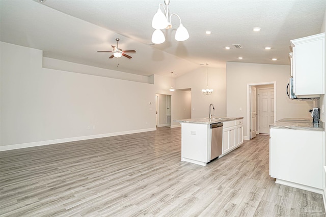 kitchen with white cabinets, a center island with sink, sink, stainless steel dishwasher, and decorative light fixtures