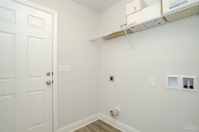 clothes washing area with hookup for an electric dryer, washer hookup, and hardwood / wood-style floors