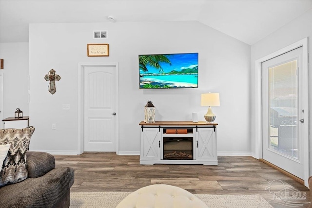 3966 Willow Glen Dr, Pace, FL 32571 - living room with visible vents, baseboards, vaulted ceiling, and wood finished floors