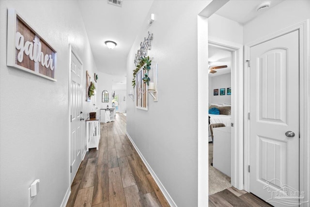 3966 Willow Glen Dr, Pace, FL 32571 - corridor featuring dark wood-style floors and baseboards